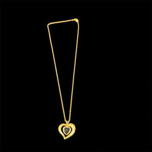 Avon goldtone heart pendant necklace 19” dark gem  inside heart